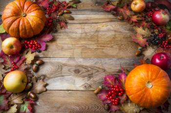 Thanksgiving or fall concept with pumpkins and apples, copy space . Thanksgiving background with seasonal vegetables and fruits. Fall background. 