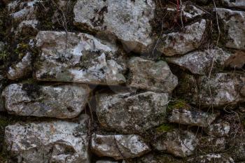 Cobblestone Rusty Wall With Moss and Branches, Pilled Rocks Structure with Roots and Dirt, Barrier of Stones with Irregular Rough Edges, Mossy Natural Hard Brick Facade