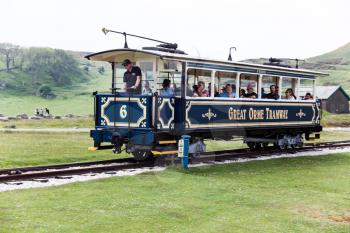A fascinating journey on the vintage blue funicular tramway. nature sightseeing during the trip on tram. The spectacular ride to the station on the cable-hauled public railway road