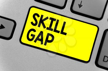 Writing note showing Skill Gap. Business photo showcasing Refering to a person's weakness or limitation of knowlege Keyboard yellow key Intention computer computing reflection document