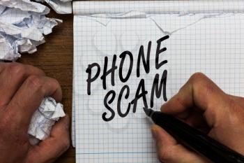 Text sign showing Phone Scam. Conceptual photo getting unwanted calls to promote products or service Telesales Man holding marker notebook crumpled papers ripped pages mistakes made