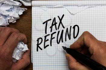 Text sign showing Tax Refund. Conceptual photo applied when money liability is less than the paid ones Man holding marker notebook crumpled papers ripped pages mistakes made