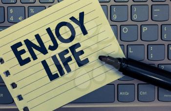 Conceptual hand writing showing Enjoy Life. Business photo showcasing Any thing, place,food or person, that makes you relax and happy Notebook paper keyboard Inspiration computer black marker