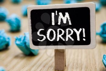 Text sign showing I am Sorry. Conceptual photo To ask for forgiveness to someone you unintensionaly hurt Blackboard crumpled papers several tries mistake not satisfied wooden floor