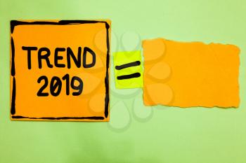 Conceptual hand writing showing Trend 2019. Business photo text things that is famous for short period of time in current year Orange paper notes reminders equal sign important messages