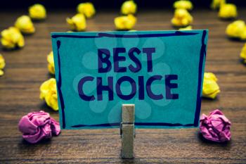 Text sign showing Best Choice. Conceptual photo act of picking or deciding between two or more possibilities Clothespin holding blue paper note crumpled papers several tries mistakes