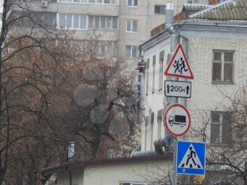 Road signs indicating the direction of movement of cars and pedestrians