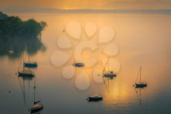 Yachts in the Early Morning Mist at Lesa Lake Maggiore