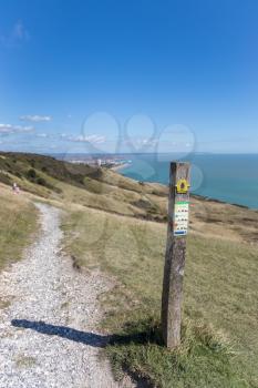 ALFRISTON, EAST SUSSEX/UK - SEPTEMBER 6 : Way marker for the South Downs Way on a summers day near Alfriston in East Sussex on September 6, 2020. Two unidentified people