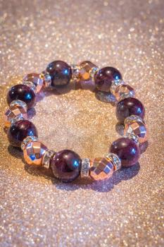 Beaded bracelet with natural garnet and rose gold plated hematite stones.
