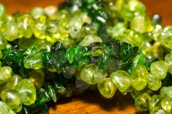 Dark green chrome diopside and olive green peridot, natural stone gravel close up.