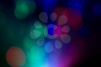 Bright colorful bokeh lights effect, defocused background.