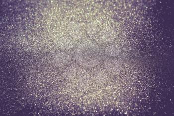Decorative glitter texture macro, defocused background, bokeh.