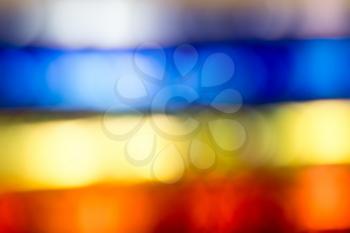 Defocused background of red, yellow and blue colors.