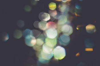 Abstract defocused background with colorful bokeh lights effect.