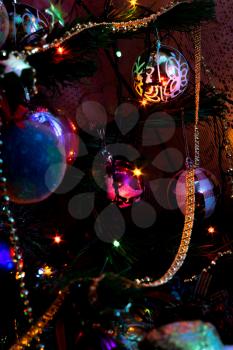 Decorated Christmas tree and colorful garland lights.