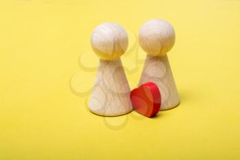 Wooden figurines of  family as concept of caring for children