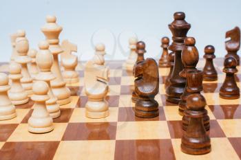 Intellectual game -chess. Wooden chess pieces on the chessboard