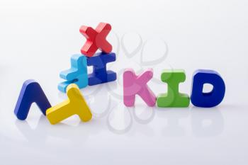 the word KID written with colorful letter blocks on white