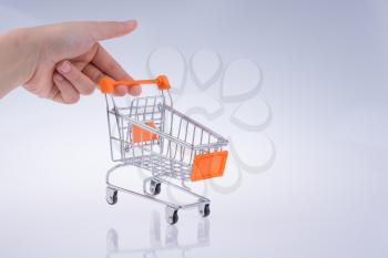 Hand holding a Cart on a white background