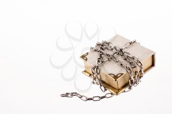 Chained book on white background