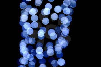 Out of focus blue light circles. Abstract bokeh effect background.