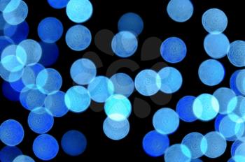 Out of focus blurry blue light dots. Abstract background.