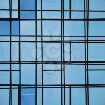 Abstract facade lines and glass reflection on modern building. Architectural detail.