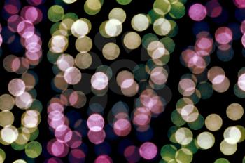 Out of focus colorful light dots. Abstract background.