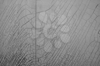 Cracked and weathered plastic window insulation film shrink abstract background.
