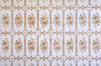 Kitchen wall tiles with floral pattern in a house built in 1970's. Vintage background.