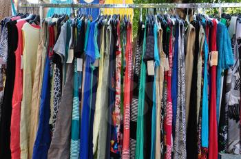 Clothes for sale at street market. Women's fashion.