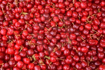 Pile of cherries fresh fruit background texture.