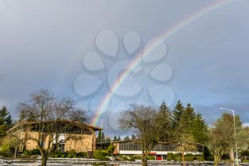 A rainbow ends at a church in Burien, Washington.