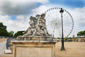 Classic statue  with Ferris wheel in background, Tuileries Garden, Paris, France