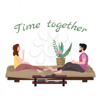 Cute loving couple sitting on bed drinking tea or drinks and eating together at home