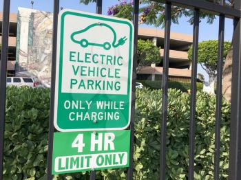 Electric vehicle charging parking space sign in green
