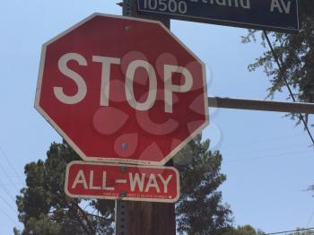 stop sign with trees octagon shape outside