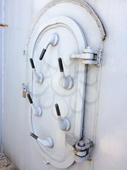 Large metal door water tight hatch locked closed concept on USS Iowa naval warship destroyer battleship