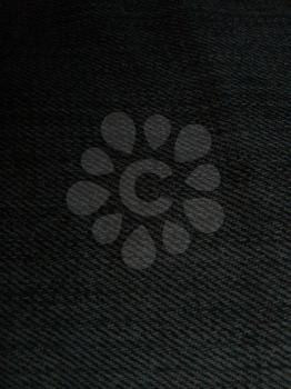 Black denim close up fabric texture threads background fashion
