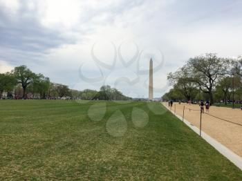 Washington monument in spring from raod view with sky
