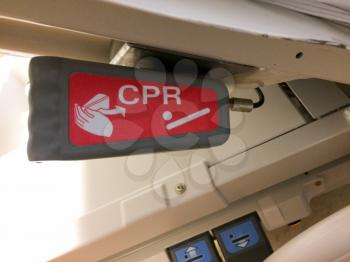 cpr hand pump lever on hospital bed in red color