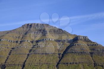 Green grass pyramid mountain of Kalsoy, Faroe Islands