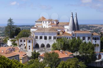 Palacio Nacional de Sintra on a sunny day with bright blue sky.