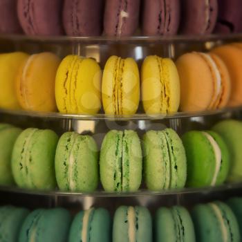 Macarons in different colors and flavours in a display