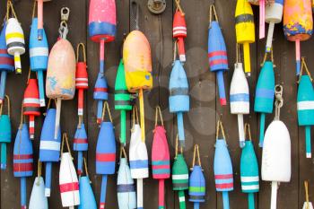 Colorful buoys on a wall of a shake in Maine, USA