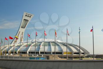 MONTREAL  CANADA - SEPT 05: Olympic stadium with international flags on september 05, 2014 in MONTREAL