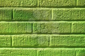 Mat brick wall paint in lime green with texture
