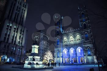 Popular Place d'Armes, Montreal, Quebec, Canada in front of Notre dame Cathedral during winter time in Montreal, Canada