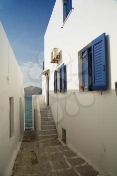 Little alley on Paros island with view on the mediterranean see
